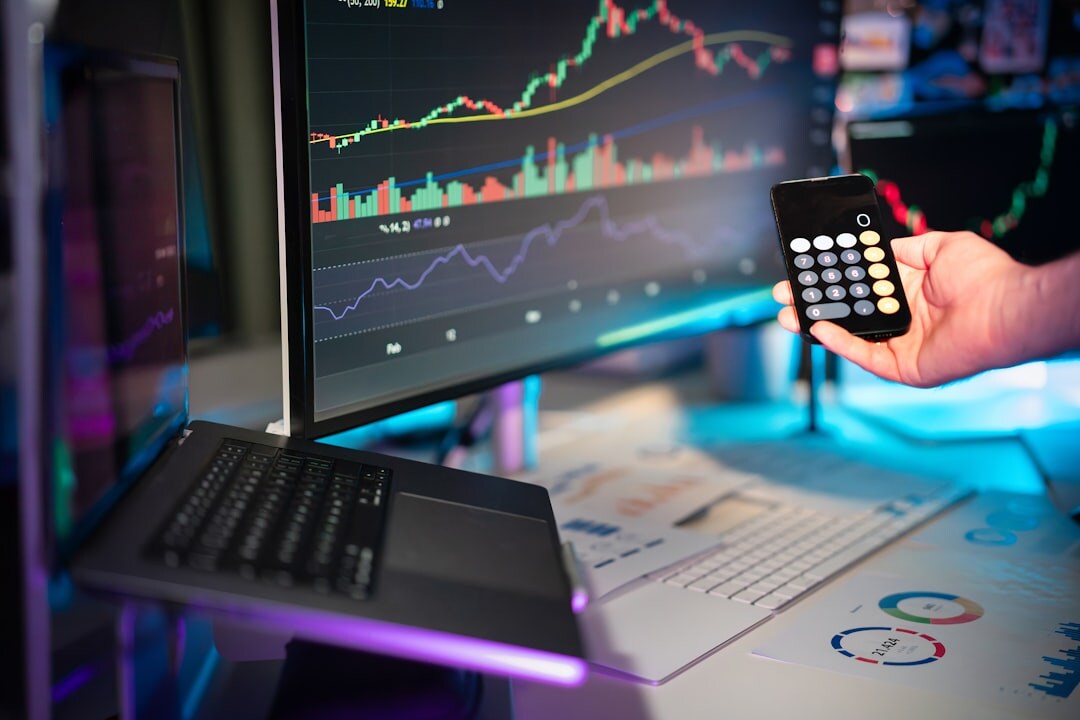 Belgian cybersecurity analyst monitoring multiple screens in a security operations center